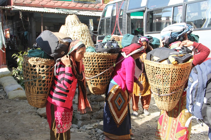 Women porters taking our luggage to the lodge
