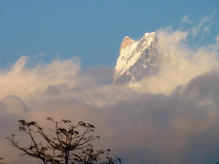 Machapuchare Mountain peeking through the clouds